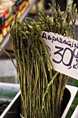 Wild asparagus at the market with a price sign
