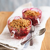 Boysenberry-apple crumbles in glass tea cups