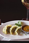 Pork Dumplings with a Peanut Dipping Sauce