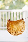 A Crepe Hanging on a line