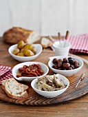 Assorted antipasti and white bread