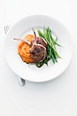 Lamb chops with green beans and tomato polenta