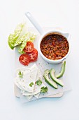 Spicy minced meat sauce, avocado and tortilla