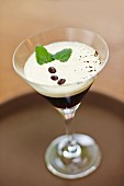 Coffee liqueur with cream and coffee beans