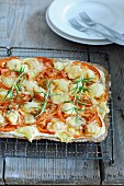 Flatbread topped with tomatoes, cheese and rosemary