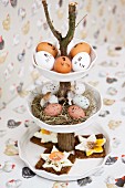Fried eggs on bread and Easter decorations on cake stand