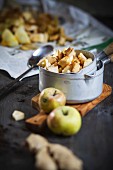 Chopped apples in a pan with spices and ginger
