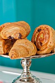 Sweet Danish pastries on a silver cake stand