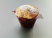 A muffin in baking parchment
