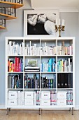 Shelves of books and folders next to spiral staircase