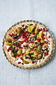 Fig and mascarpone tart with pomegranate seeds and pistachios