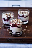 Yoghurt dessert with cherries, elderberries and pecan brittle