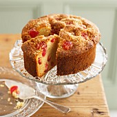 Almond and cherry cake, partly sliced