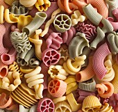 Pasta in assorted shapes and colours (filling the image)
