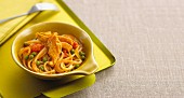Noodles with curry sauce, chicken and vegetables