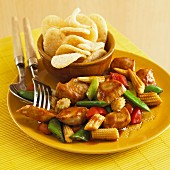 Sweet and sour chicken with baby sweetcorn and prawn crackers