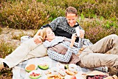 A couple having a picnic on a heath