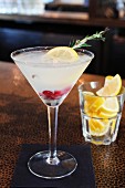 Lemon rosemary martini with cranberries