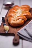 Plaited loaf on a wooden board