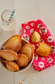 Madeleines, with a bottle of milk to one side
