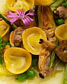 Cappelletti pasta with mussels, artichokes and peas (detail)