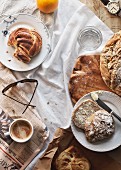 Breakfast Table with white bread, Croissant, cinnamon snail , Fruit, coffee
