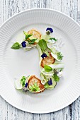 Fried scallops, green asparagus, summer cabbage and beech leaves.