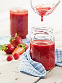 Strawberry & raspberry jam in jars