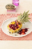 Stuffed pineapple with red cabbage salad