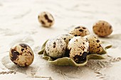 Quail's eggs in a green bowl