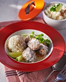 Veal fricassee with grated coconut, rice and lime