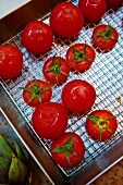 Washed tomatoes on a draining rack