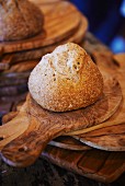 Crispy bread roll on a chopping board