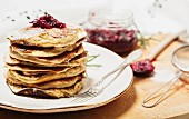 Stacked pancakes with cranberry jam