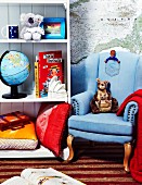 Child's room decorated with an armchair, shelves and Australian themed decorations