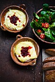 Baked Camembert with cranberries and spinach salad