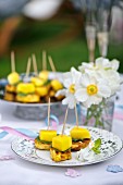 chicken and mango skewers on a baptism party table