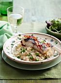 Pea risotto with fillet of bass and pancetta