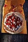 Nut tart with jam and icing sugar