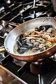 Seafood cooking in white wine