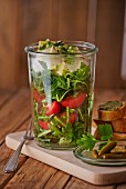 Rocket salad with tomatoes and mozzarella in a glass