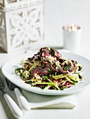 Beef salad with pomegranate seeds and vegetables (Cambodia)
