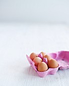 Six organic eggs in an egg box