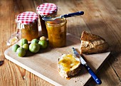 Greengage jam and bread on a chopping board