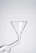 Glass funnel in glass bottle