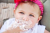 Young Girl with Cake Frosting on Face