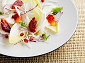 Winter salad of chicory, blood orange, pomegranate and red onion