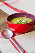 Cream of courgette soup garnished with a dollop of sour cream