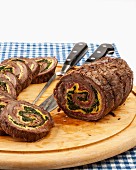 Roasted beef stuffed with spinach and omelette