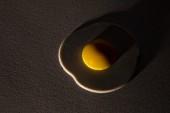 Plastic Fried Egg in Dramatic Light